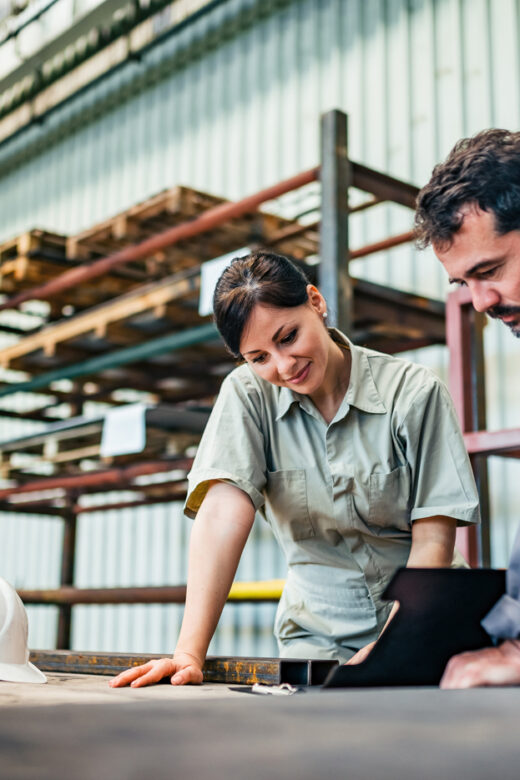 man and woman in a factory